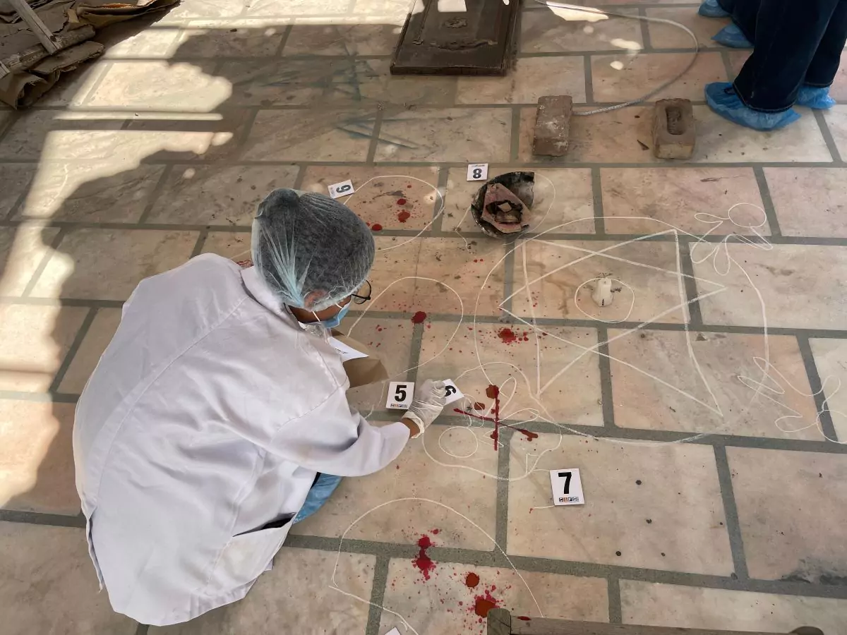 Student meticulously collecting forensic evidence at a simulated crime scene, gaining hands-on experience in crime scene investigation protocols.